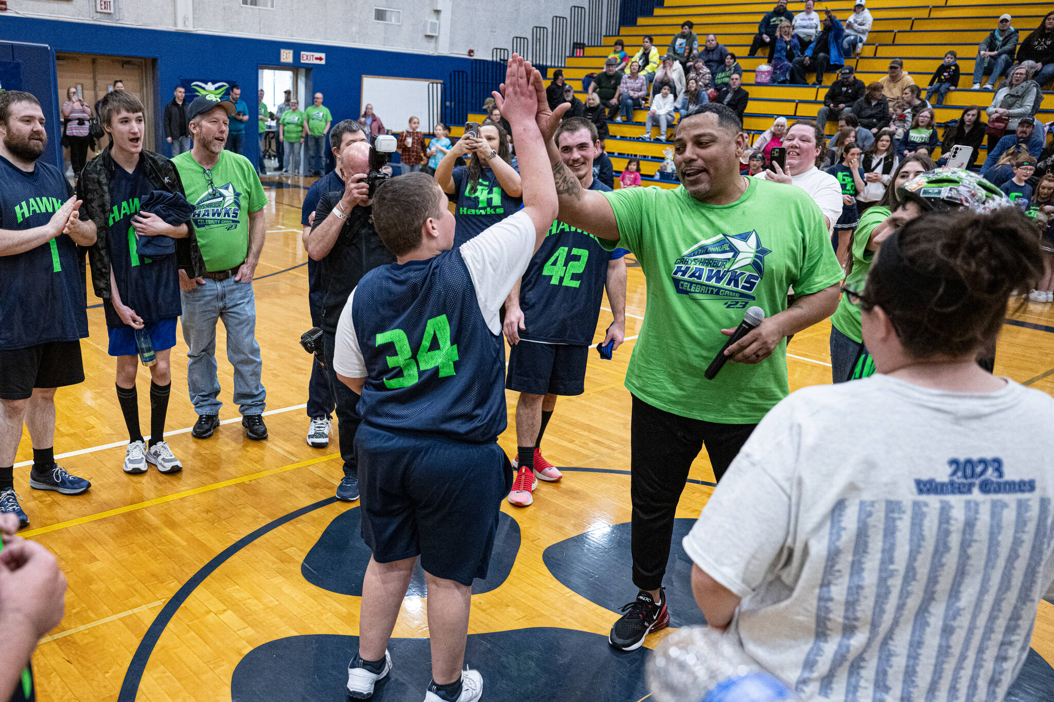 Mary White
Gerald Smiley, former Texas Rangers pitcher, high-fives Kyler Parmley at the 2023 Grays Harbor Hawks celebrity basketball game.