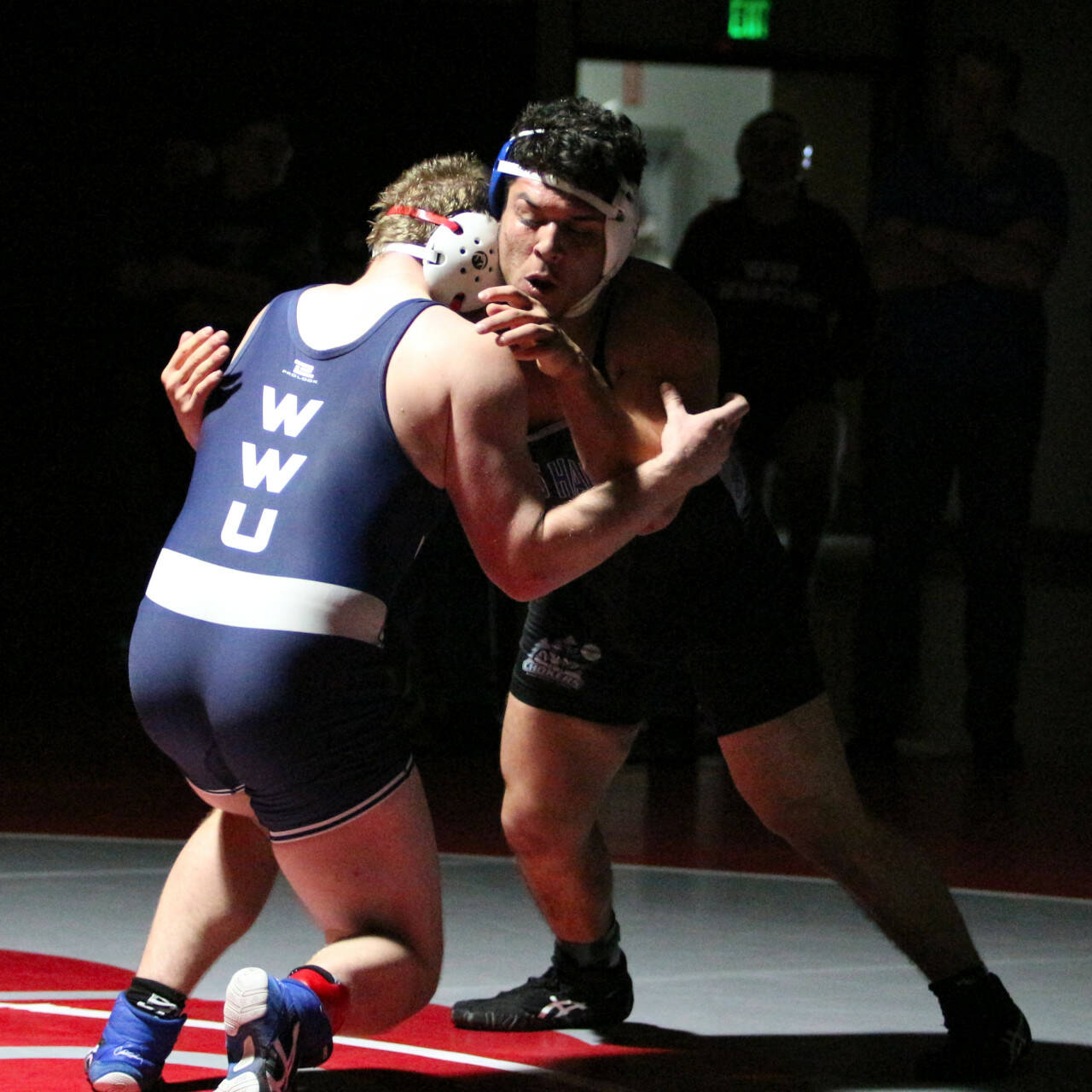 RYAN SPARKS | THE DAILY WORLD Grays Harbor College’s Joshua Luna, right, and Western Washington’s Jacob Westfall compete in the 197-pound final at the NCWA Northwest Conference Championships on Saturday at Hoquiam High School.