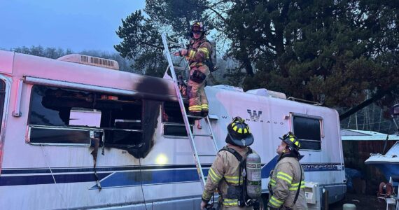 Hoquiam Fire Department
Firefighters investigate a Hoquiam trailer after a fire swept through, killing the resident.