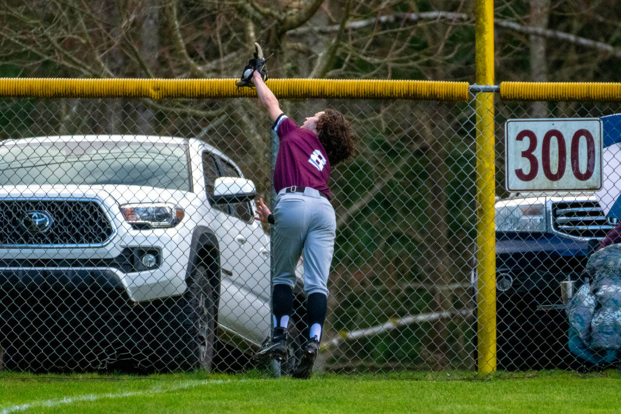 PHOTO BY FOREST WORGUM Montesano’s Tucker Eaton makes a diving catch during a 5-4 win over Rochester on Tuesday at Vessey Field in Montesano.