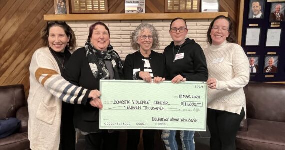 Matthew N. Wells / The Daily World
Domestic Violence Center of Grays Harbor (DVC) was the big winner at the 100+ Harbor Women Who Care event March 12. While the big check here doesn’t show it, DVC got $37,240 to date, combined donor sources. One survivor who bravely shared a story that will make anyone with an empathetic nature cry. Thankfully for her and her children, they’re out of that situation and are on the way to a life of peace, thanks to DVC.