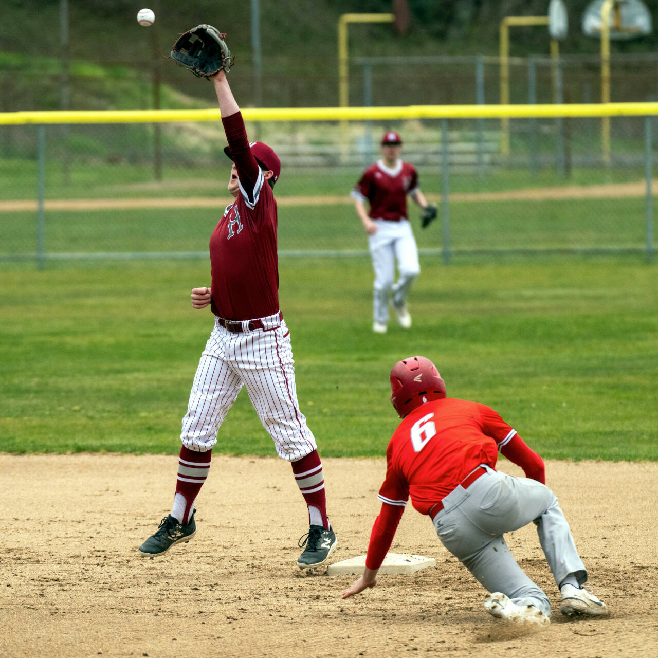 PHOTO BY FOREST WORGUM Hoquiam’s Joey Bozich reaches up to make a catch during a 4-3 win over Castle Rock on Wednesday at Olympic Stadium in Hoquiam.