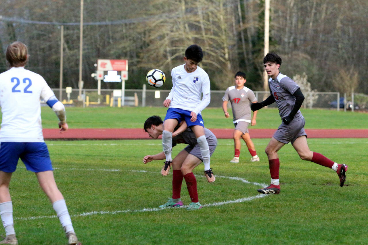 RYAN SPARKS | THE DAILY WORLD Elma’s Ivan Rodriguez, top, and Hoquiam’s Michael Garcia, bottom, compete for a loose ball during Elma’s 3-0 win on Friday in Hoquiam.