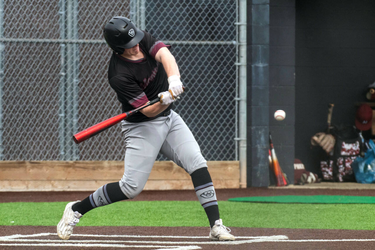 PHOTO BY FOREST WORGUM Montesano senior Cam Taylor connects with a pitch during a double header against Hoquiam on Saturday in Shelton.