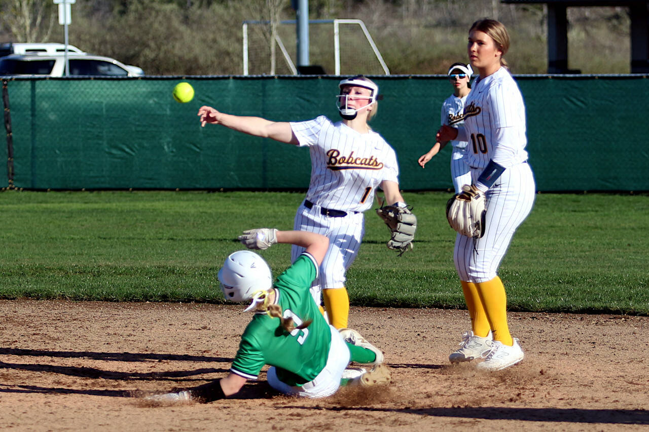 RYAN SPARKS | THE DAILY WORLD Aberdeen shortstop Zoe Vessey (1) throws to first to complete a double-play against Tumwater’s Erika Schock (9) during the sixth inning of a 5-0 loss to Tumwater on Friday in Aberdeen.