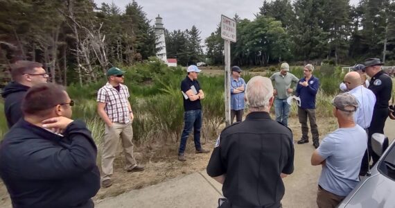 John Shaw
Marc Titus, a community wildfire resilience specialist with the Department of Natural Resources, talks with a group of local leaders and fire officials about wildfire risk in Westport at the Grays Harbor Lighthouse on Aug. 10, 2023.