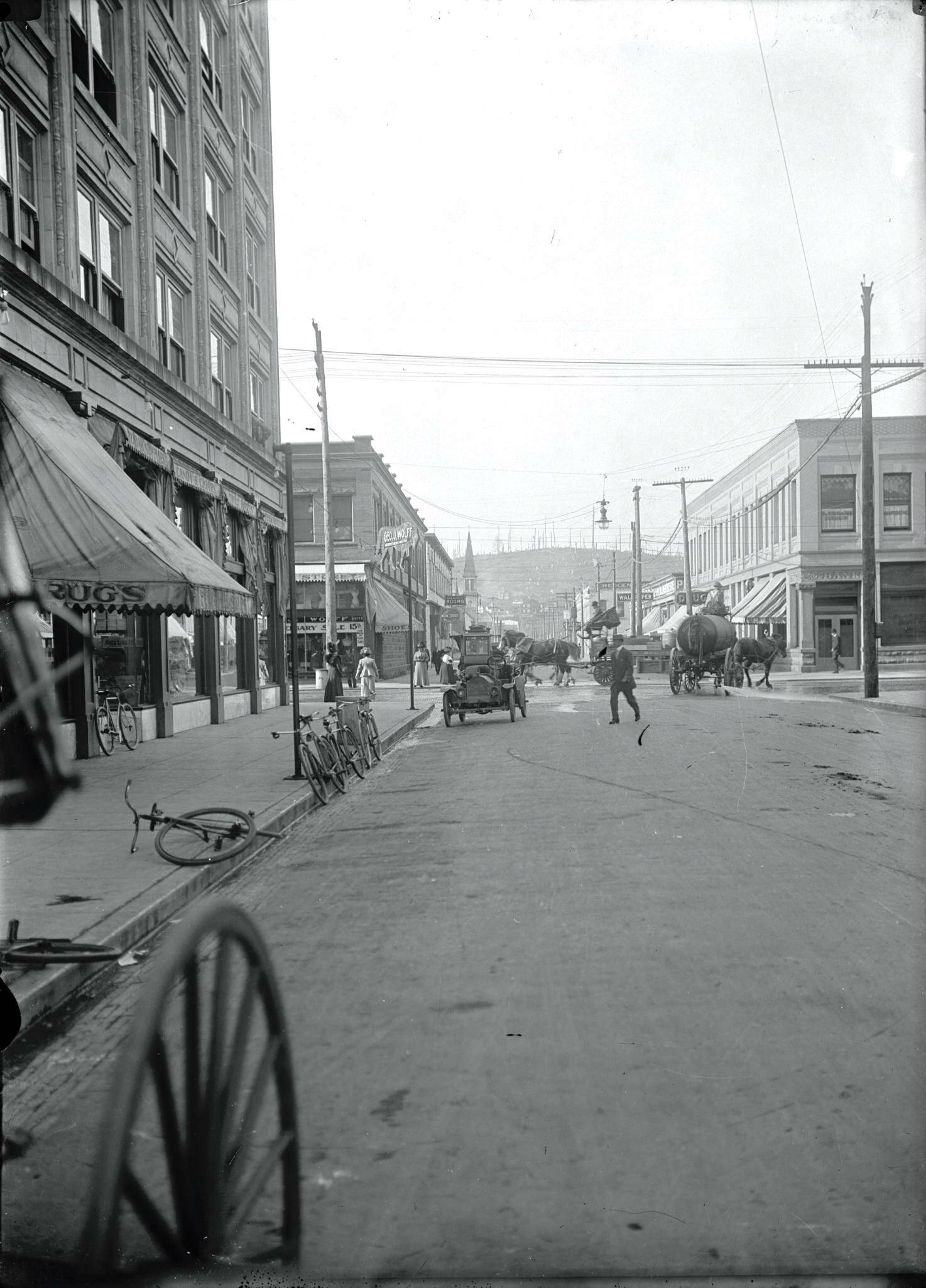 Polson Museum
This archival photo shows various modes of transportation near the intersection of East Heron and South H St., circa-1910. You can see bicycles, horse-drawn vehicles, and early street sweeper and an automobile. This is part of Polson Museum’s new centerpiece exhibit titled “The Spectacular Vanishes: When Horses Left the Harbor.”