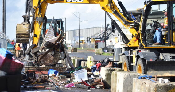 Clayton Franke / The Daily World
City of Aberdeen workers use heavy machinery April 3 to scoop up debris from the homeless encampment on River Street. The city has spent on average about $20,000 per month since the start of 2023 on trash cleanup in the downtown area.