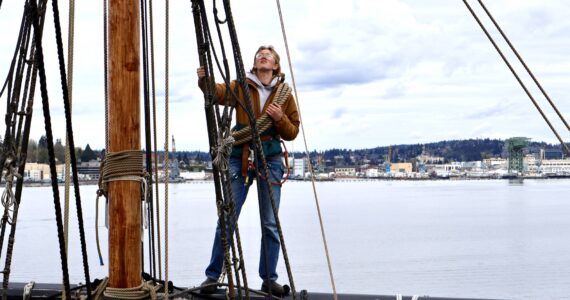 Bosun Kate Miller-Vickers helps ready the yards of the Lady Washington for the 2024 sailing season. (Michael S. Lockett / The Daily World)