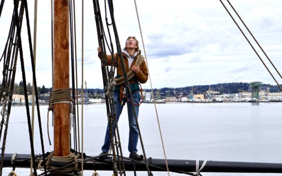 Bosun Kate Miller-Vickers helps ready the yards of the Lady Washington for the 2024 sailing season. (Michael S. Lockett / The Daily World)