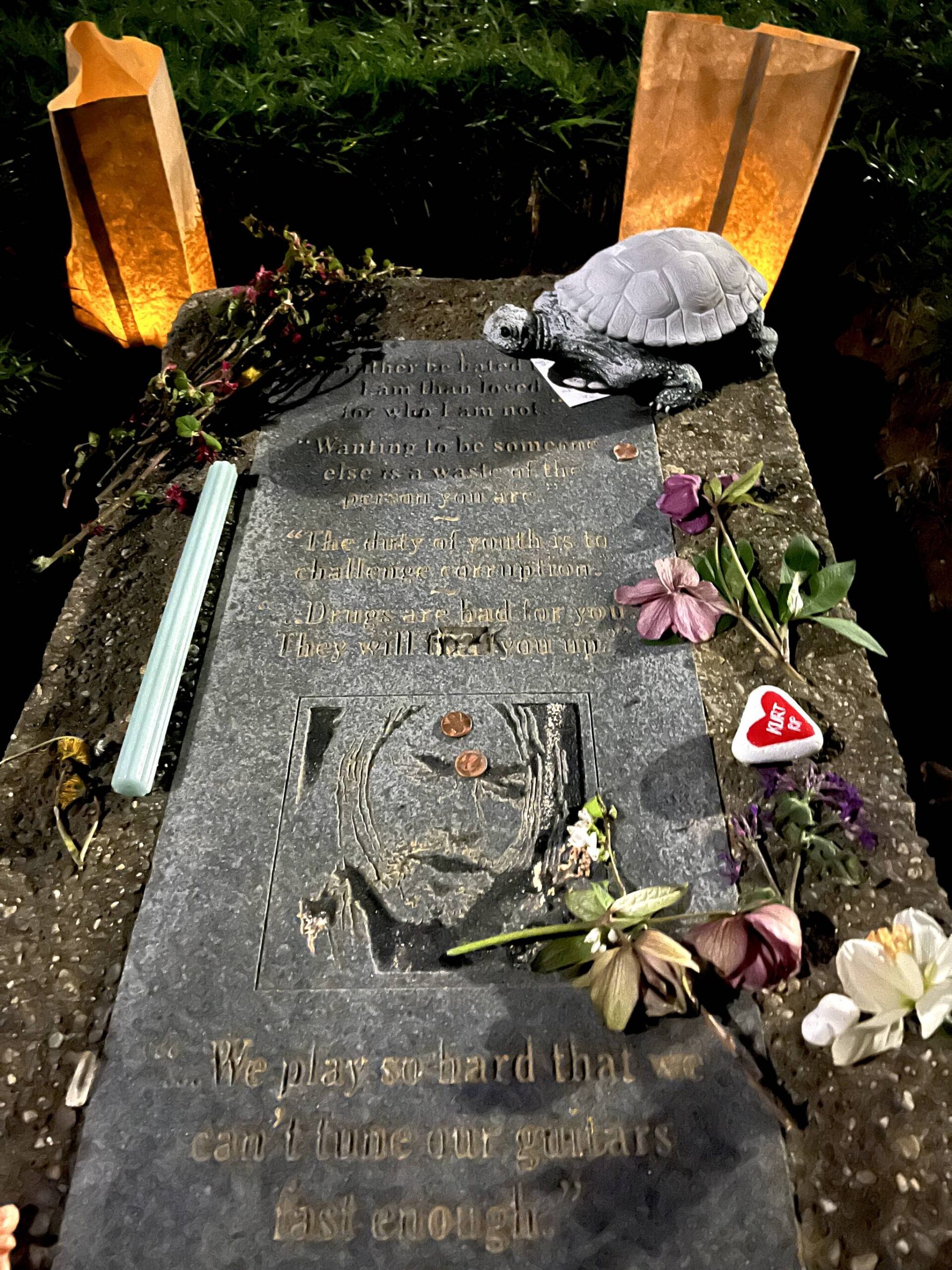 Matthew N. Wells / The Daily World
The polished granite stone includes a few quotes from the late Kurt Cobain. People showed up to Kurt Cobain Memorial Park on Friday night to pay their respects to the musician and to the man he was. One quote on the stone should resonate with those fans who loved Cobain: “Wanting to be someone else is a waste of the person you are,” said Cobain, who was an individual until the end of his shortened life.
