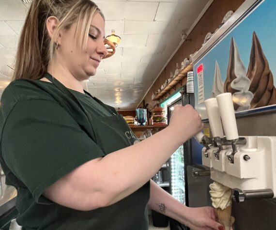 <p>Matthew N. Wells / The Daily World</p>
                                <p>Andrea Plummer, who’s worked at Clarks Restaurant for about 15 years, first experienced Clarks as a young customer. She said she was about “knee-high.” Plummer, seen serving up a homemade ice cream cone, is one of the friendly people who work at the restaurant with roots in the 1920s.</p>
