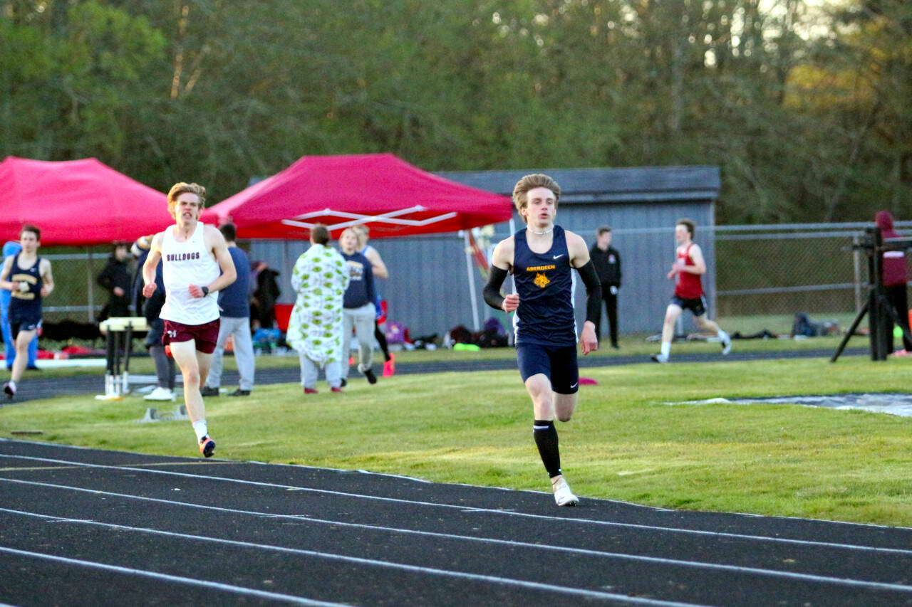 RYAN SPARKS | THE DAILY WORLD Aberdeen’s Henry Nelson, right, leads Montesano’s Jesse Anderson, left, down the home stretch of the boys 800-meter race at the Ray Ryan Memorial All-County Meet on Friday in Ocean Shores.