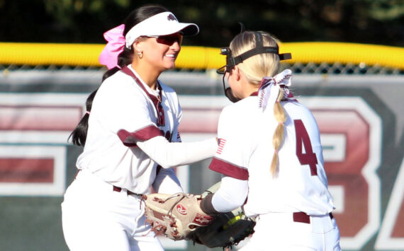 RYAN SPARKS | THE DAILY WORLD Montesano centerfielder Adda Potts, left, is congratulated by shortstop Addi Kersker after making a diving catch during a 7-1 loss to Auburn Riverside on Tuesday at Montesano High School.