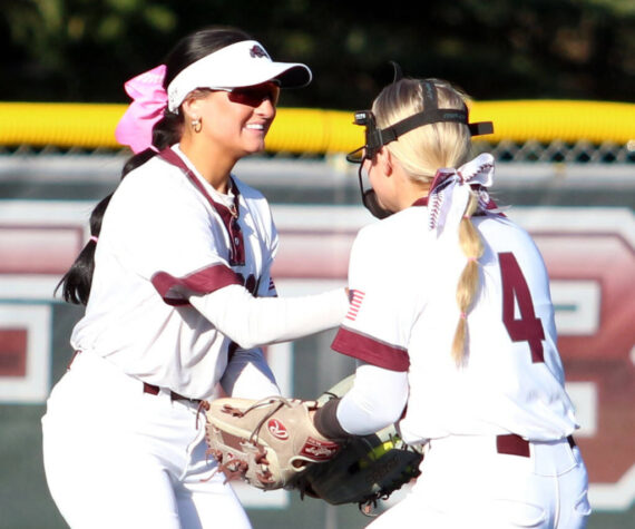 RYAN SPARKS | THE DAILY WORLD Montesano centerfielder Adda Potts, left, is congratulated by shortstop Addi Kersker after making a diving catch during a 7-1 loss to Auburn Riverside on Tuesday at Montesano High School.