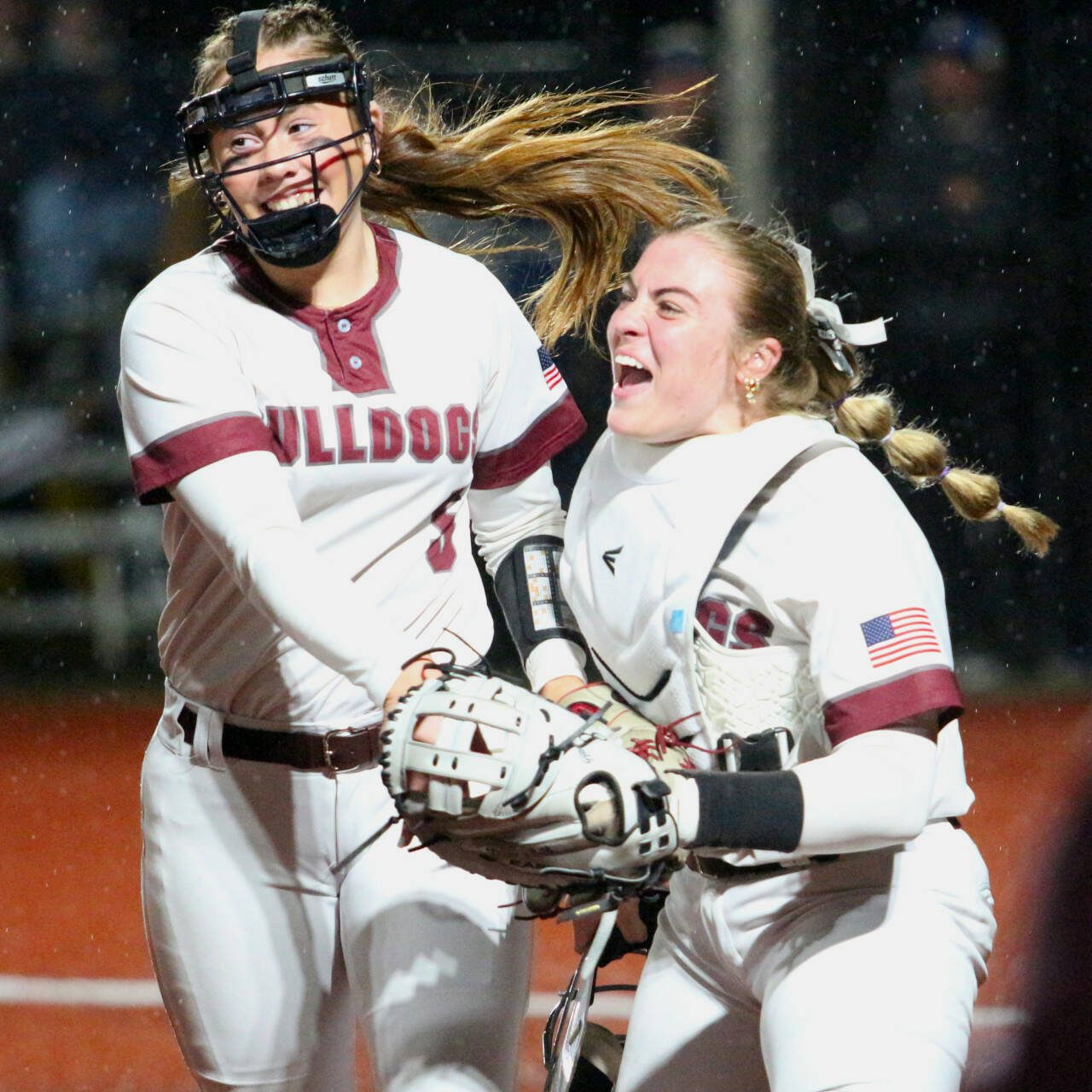 RYAN SPARKS | THE DAILY WORLD 
Montesano pitcher Grace Gooding, left, and catcher Ali Parkin celebrate a pickoff play during a 7-3 win over Rochester Saturday night at Dick Tagman Field in Montesano.
