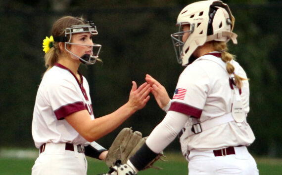 RYAN SPARKS | THE DAILY WORLD Montesano pitcher Riley Timmons, left, and catcher Ali Parkin prepare for the start of an inning during the Bulldogs’ 7-0 win on Wednesday in Montesano.