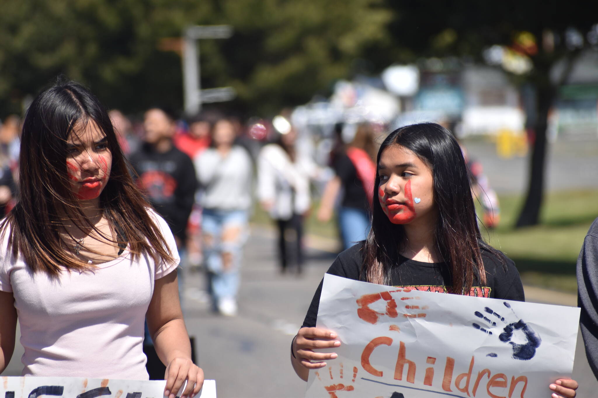 Clayton Franke / The Daily World
Sisters Markie (right) and Kenzie McCrory led a walk down Point Brown Avenue in Ocean Shores May 7 to raise awareness for Missing and Murdered Indigenous People.