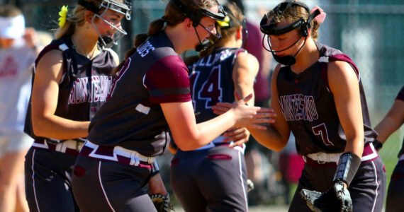RYAN SPARKS / THE DAILY WORLD 
Montesano first baseman Kylee Wisdom (left) gives five to second baseman Alyssa Maldonado (7) during a 13-0 win over Hoquiam in a 1A District 4 semifinal game on Wednesday in Centralia.