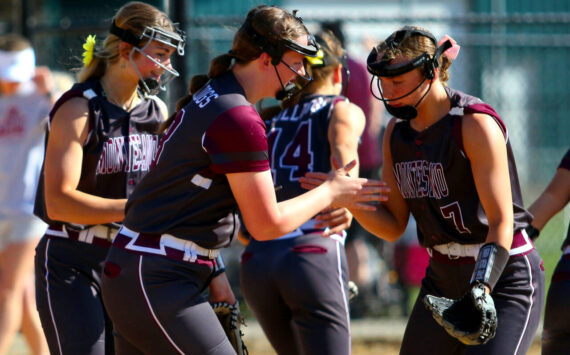 RYAN SPARKS | THE DAILY WORLD Montesano first baseman Kylee Wisdom (left) gives five to second baseman Alyssa Maldonado (7) during a 13-0 win over Hoquiam in a 1A District 4 semifinal game on Wednesday in Centralia.