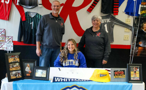 PHOTO BY LARRY BALE 
Raymond senior Kyndal Koski (sitting) signed a Letter of Intent to play volleyball for Whitman College in the fall. Koski is pictured with Raymond Athletic Director Mike Tully (left) and Raymond-South Bend head volleyball coach Julie Jewell.
PHOTO BY LARRY BALE Raymond senior Kyndal Koski (sitting) signed a Letter of Intent to play volleyball for Whitman College in the fall. Koski is pictured with Raymond athletic director Mike Tully (left) and Raymond-South Bend head volleyball coach Julie Jewell.