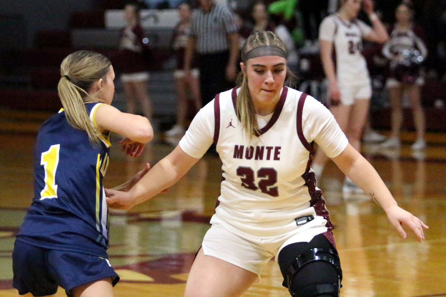 RYAN SPARKS | THE DAILY WORLD Montesano senior Ali Parkin (32) defends against Aberdeens Sophie Knutson during the Bulldogs 42-21 win on Thursday in Montesano. Parkins injury in the fourth quarter led to a premature ending to the contest.