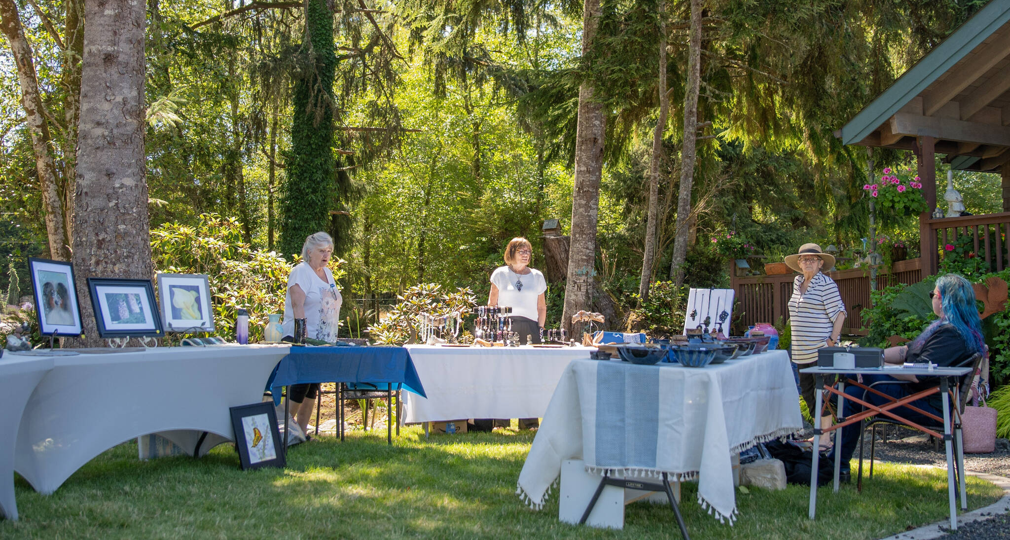 From left, Melanie Knight (jewelry, wall art), Lyn Nelson (hand-built pottery), Sue Tucker (bead weaving) and Miriam Storm (wheel-thrown pottery, ceramic jewelry) display their art.