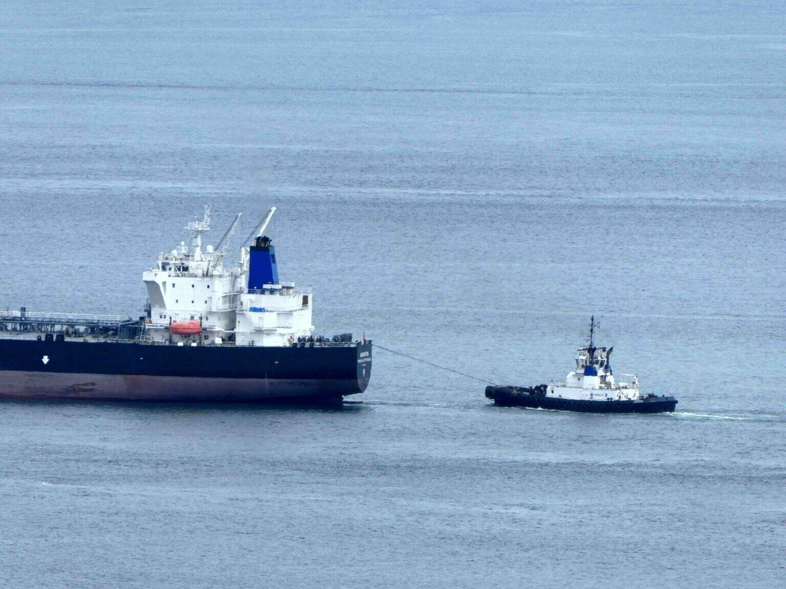A tug tethers to an Anacortes-bound tanker as it turns into Rosario Strait carrying crude oil from Alaska.