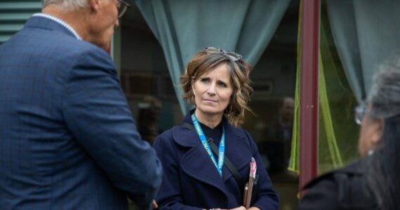 Hailey Hoffman / Cascadia Daily News
Ferndale Superintendent Kristi Dominguez, center, speaks with former Gov. Jay Inslee in September 2023. Dominguez is one of 20 Washington superintendents trying to reshape the state’s school funding system.