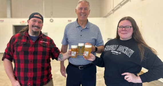 Port of Grays Harbor
Port of Grays Harbor Executive Director Leonard Barnes celebrates Steam Donkey’s new lease that will double production capacity with owners Jonathan and Stefanie Bennett.