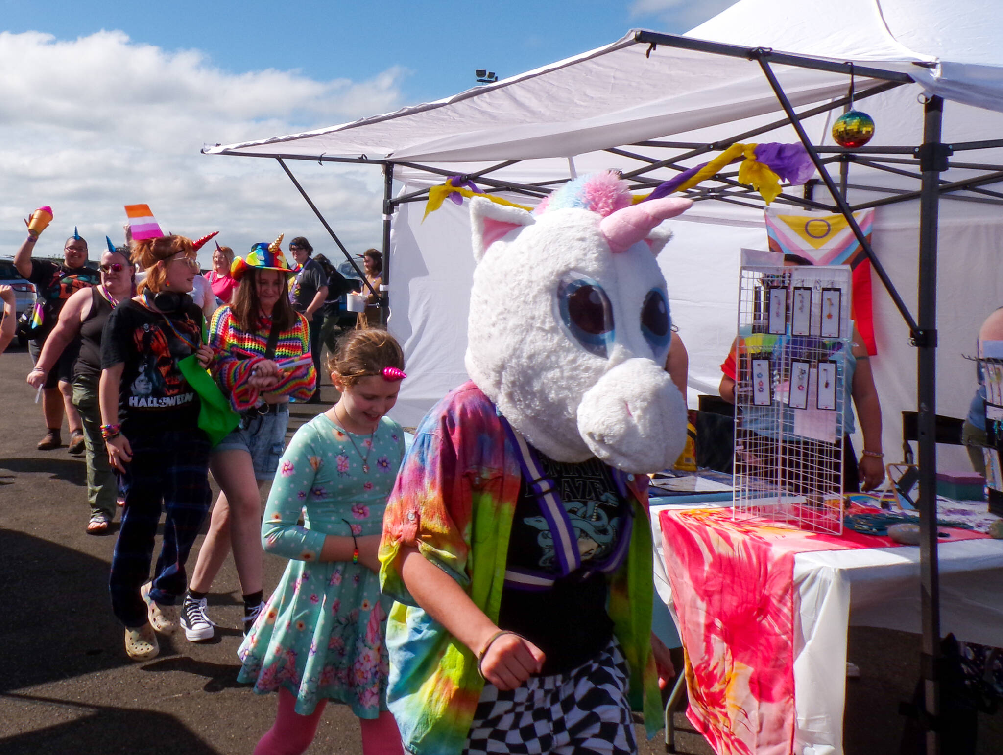 The unicorn parade marches in front of vendors at the annual Love Reigns: Grays Harbor Pride Festival on Saturday.