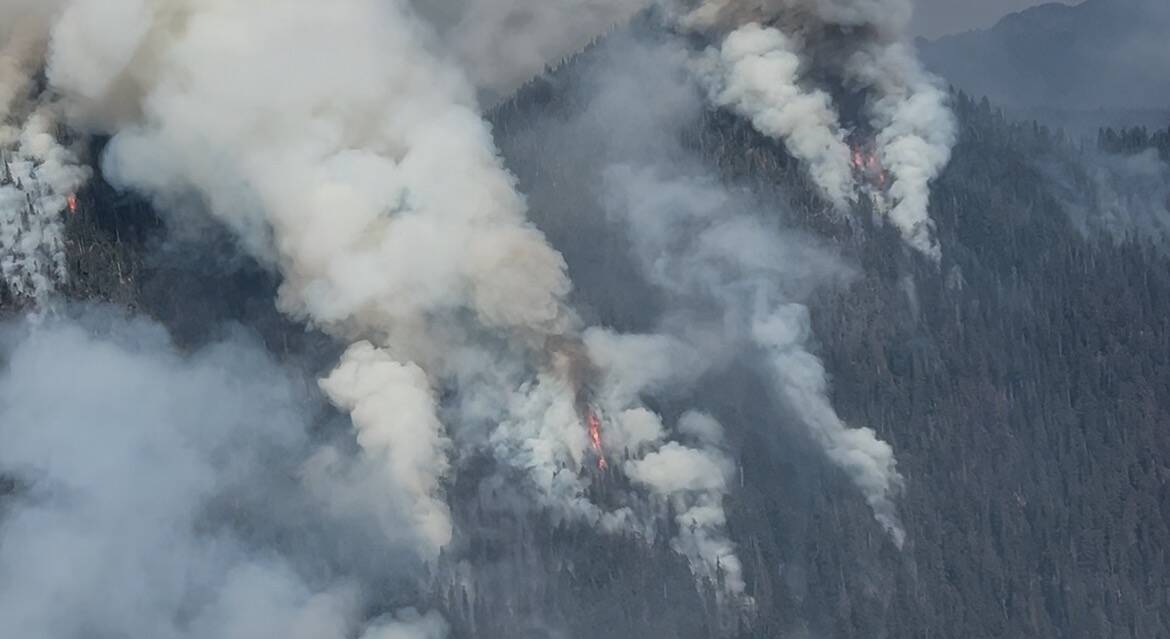 National Forest Service
Fire continues to creep upland in the steep terrain north of Lake Cushman.