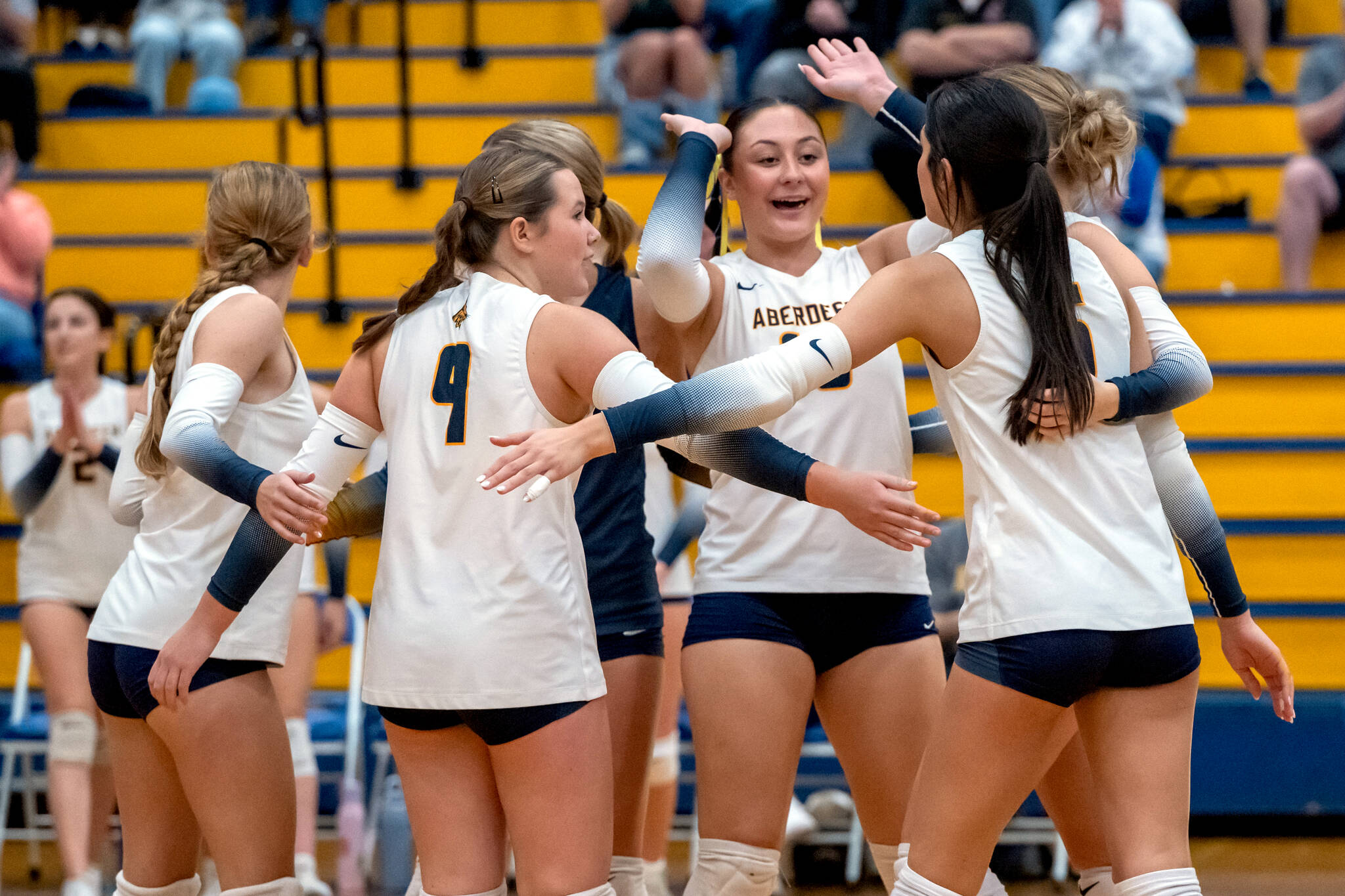 PHOTO BY FOREST WORGUM Aberdeens Hadley Lowery (background) celebrates with her teammates during a straight-set win over Tenino on Thursday at Aberdeen High School.