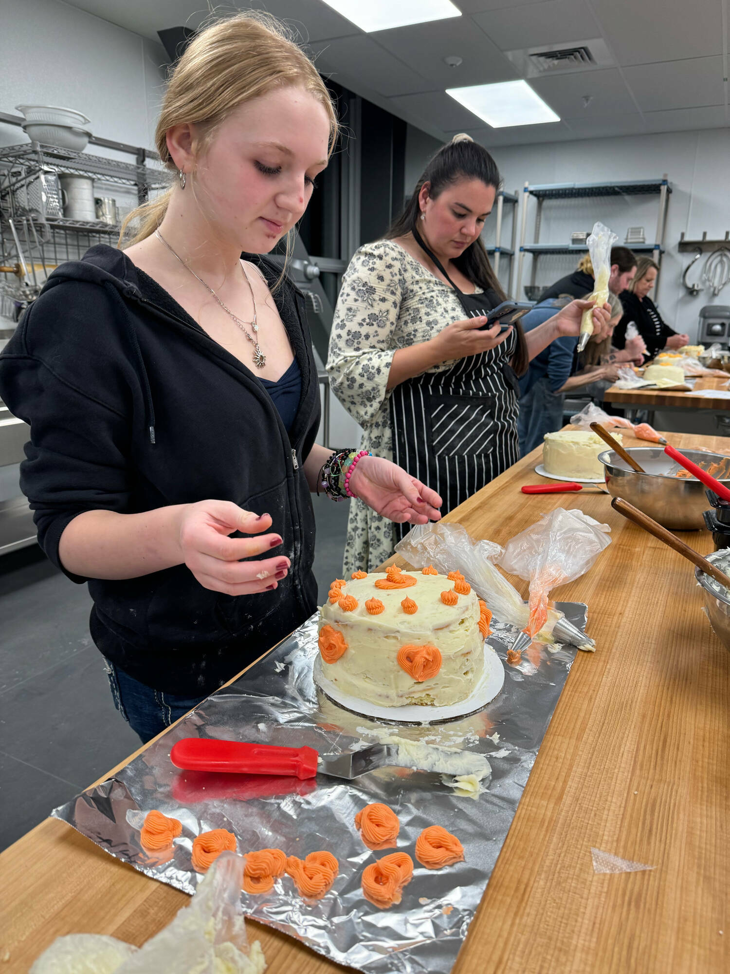 Students learn how to make a cake.