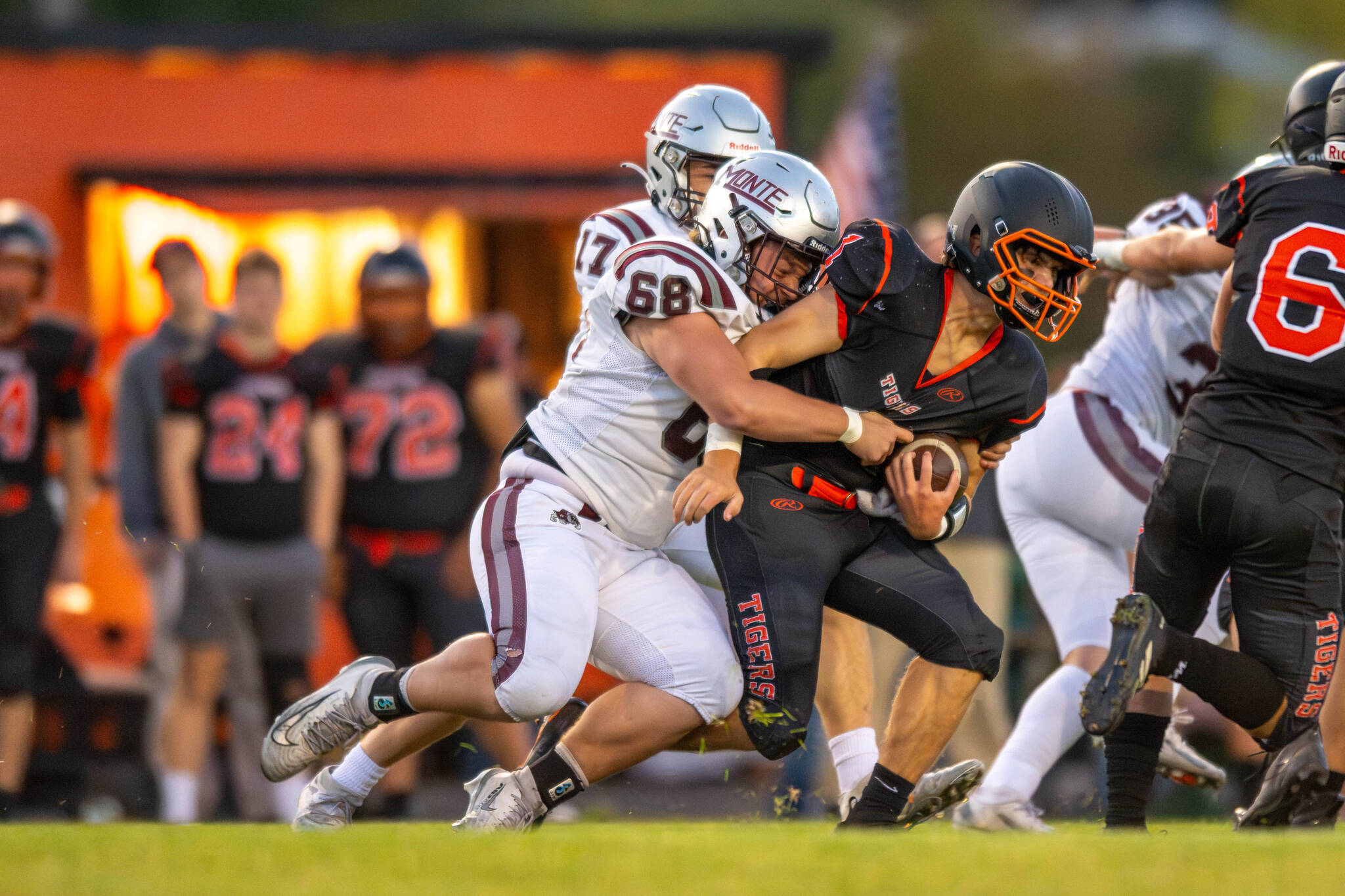 PHOTO BY FOREST WORGUM Montesano defensive lineman Kyle Caton (68) tackles Napavine quarterback Grady Wilson during the first quarter of the Bulldogs 56-0 win on Friday in Napavine.