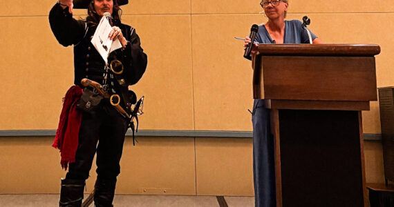 Kyndra Burkland photos
A pirate auctioneer and North Beach PAWS’ Nanette Sparrow.