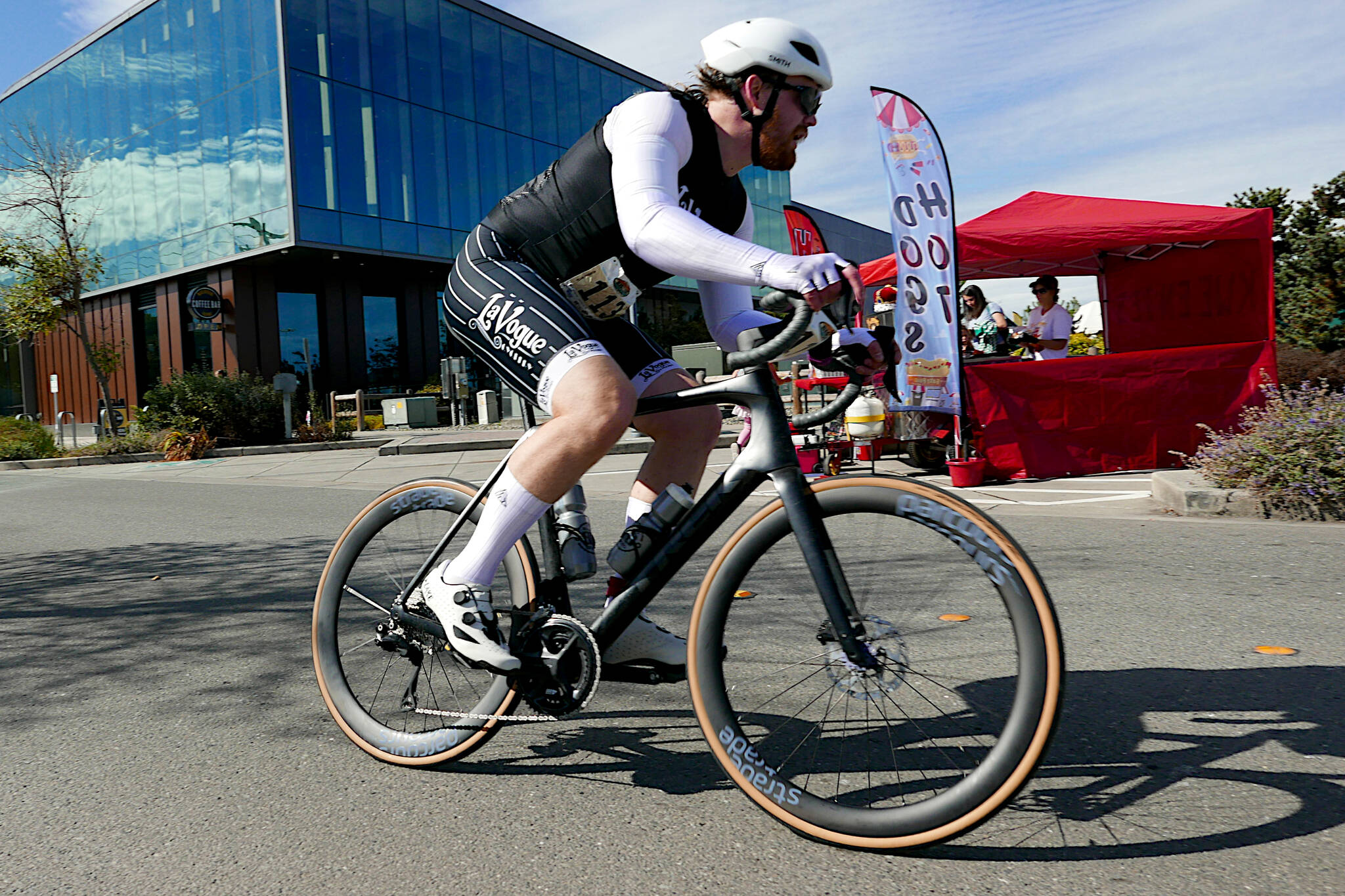 SUBMITTED PHOTO Team Motley Tu Tu’s Bill Wallace competes in the road bike portion of the Big Hurt Multi-Sport Race on Saturday in Port Angeles. The Harbor-based team placed second overall for the second year in a row.