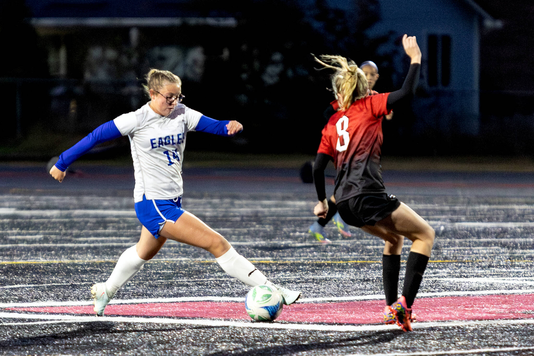 PHOTO BY MIKE ROBERTS Elma senior Chloe Donais (left) dribbles the ball during a 7-0 loss to Tenino on Tuesday in Tenino.