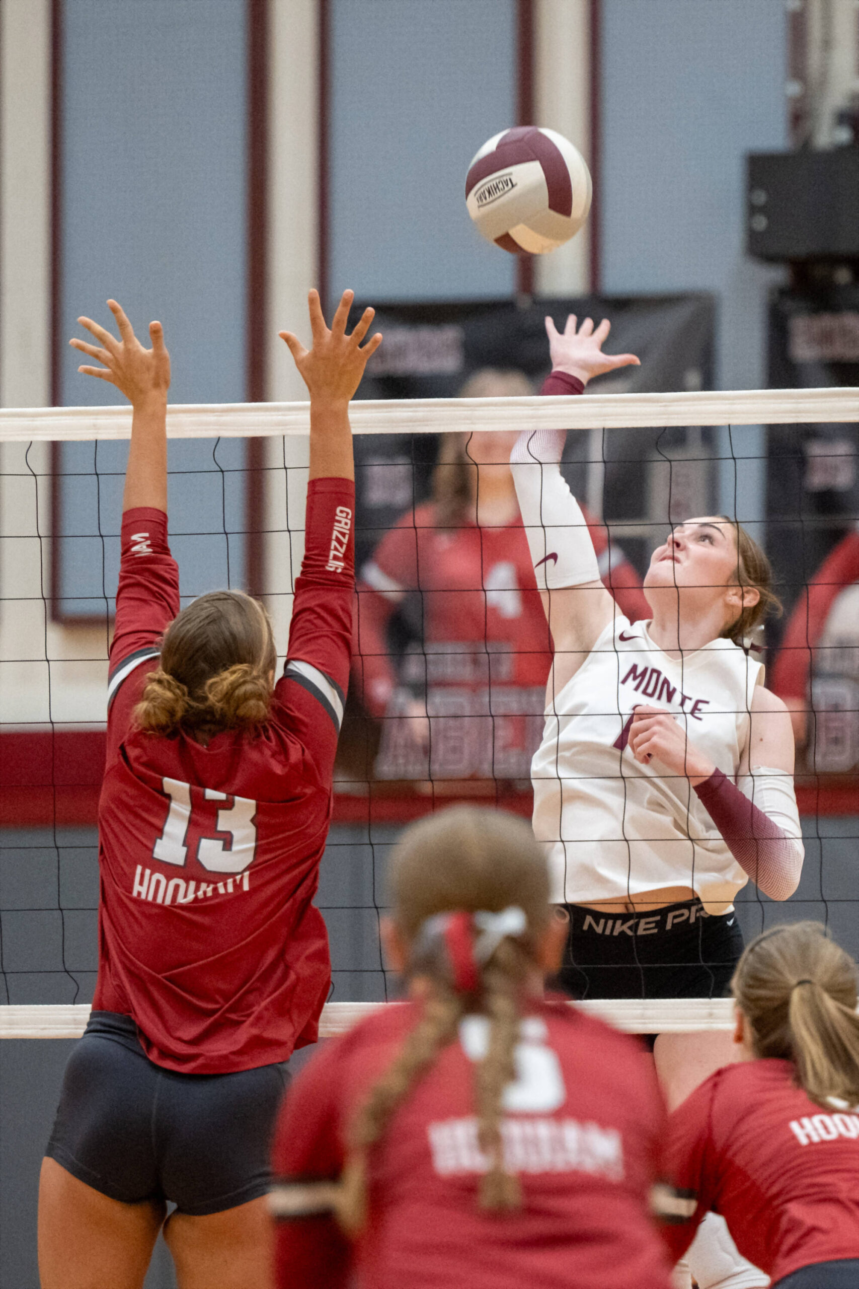 PHOTO BY FOREST WORGUM Montesano middle blocker Violet Prince (right) attempts a spike against Hoquiams Piper Stankavich (13) during the Bulldogs 3-0 win on Tuesday in Hoquiam.