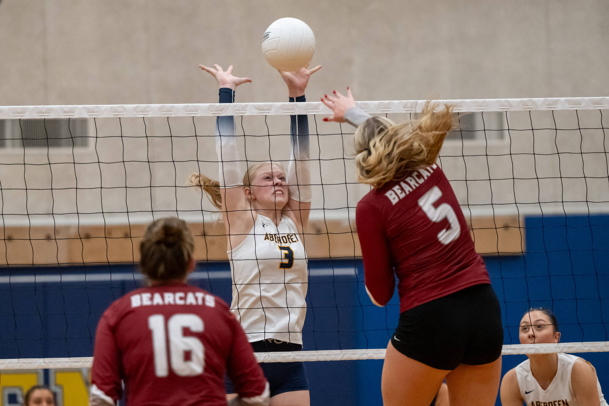PHOTO BY FOREST WORGUM Aberdeen middle blocker Dallyn Williams (3) attempts to block the shot of W.F. Wests Vivy Witchey during the Bobcats 3-0 win on Thursday in Aberdeen.