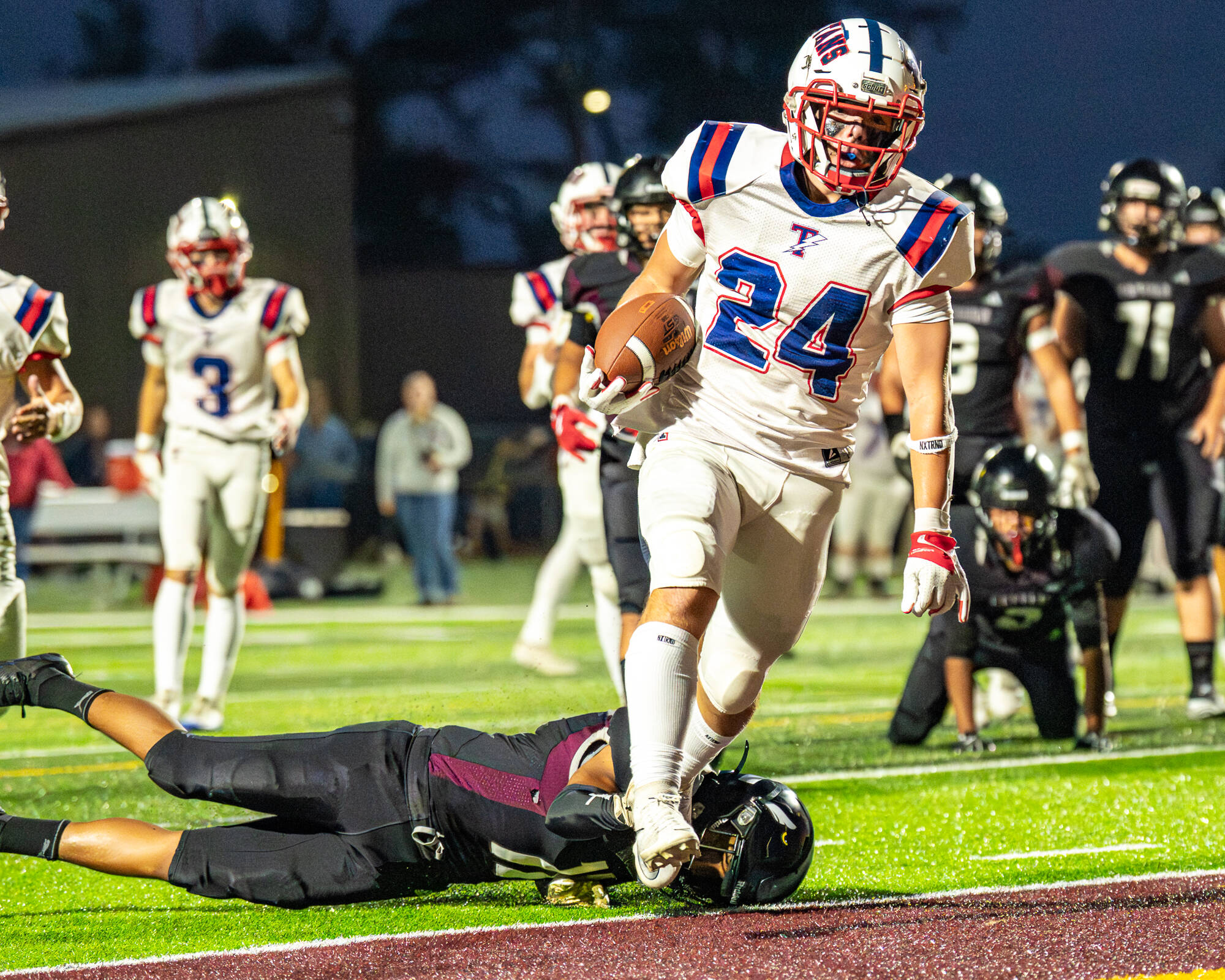 PHOTO BY MATT RUMBLES Pe Ell-Willapa Valley running back Lucas Lusk (24) scores a touchdown during a 41-6 victory over Raymond-South Bend on Friday at Sanchez Field in South Bend.