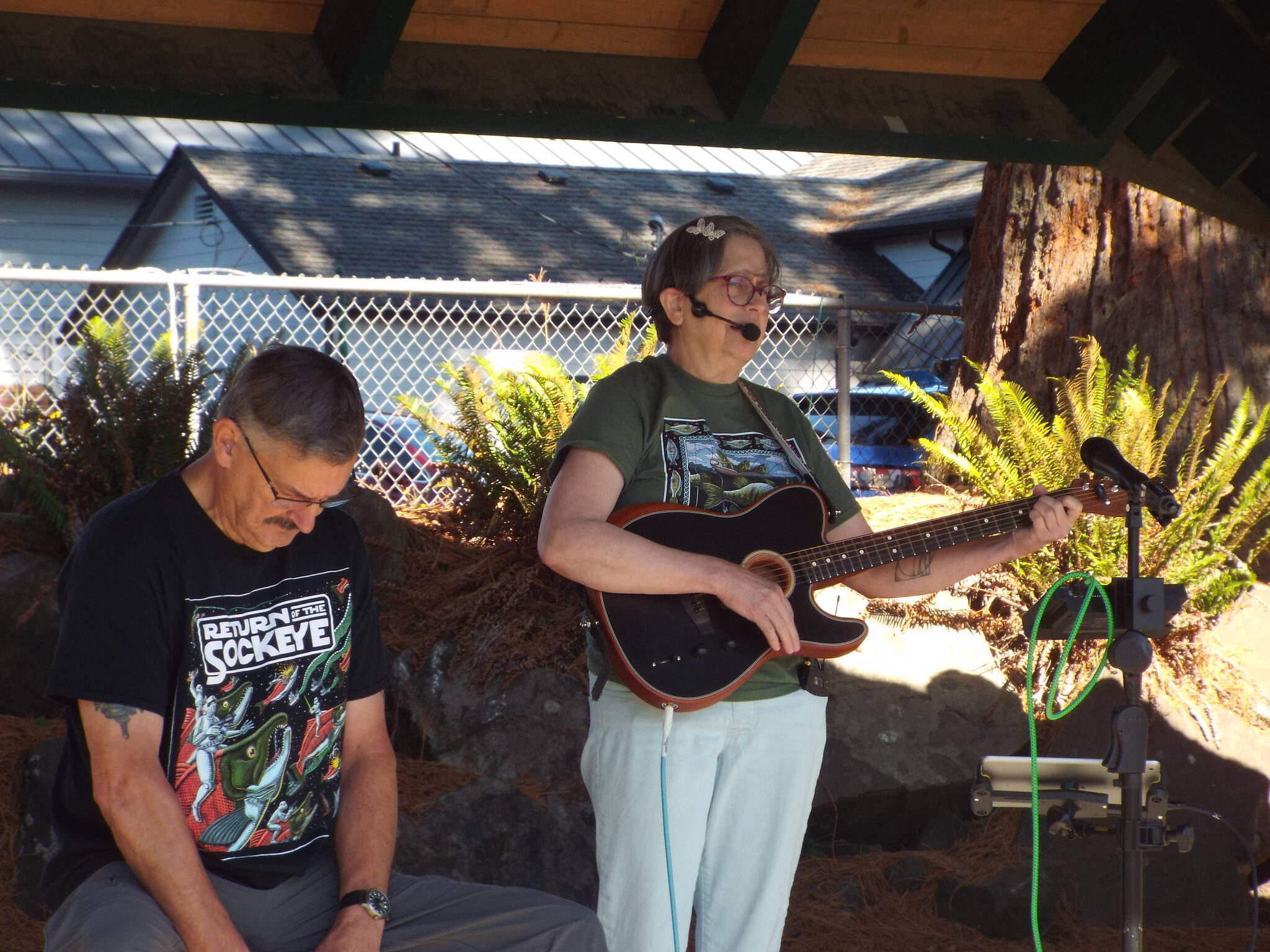 Andrea Watts / The Daily World
Donna Albert sang a protest song she wrote during Sunday’s Fall Fest: A Festival of Community and Action in Montesano, accompanied by her husband, Kenneth E. Albert, who retired as Grays Harbor County Treasurer at the end of June.