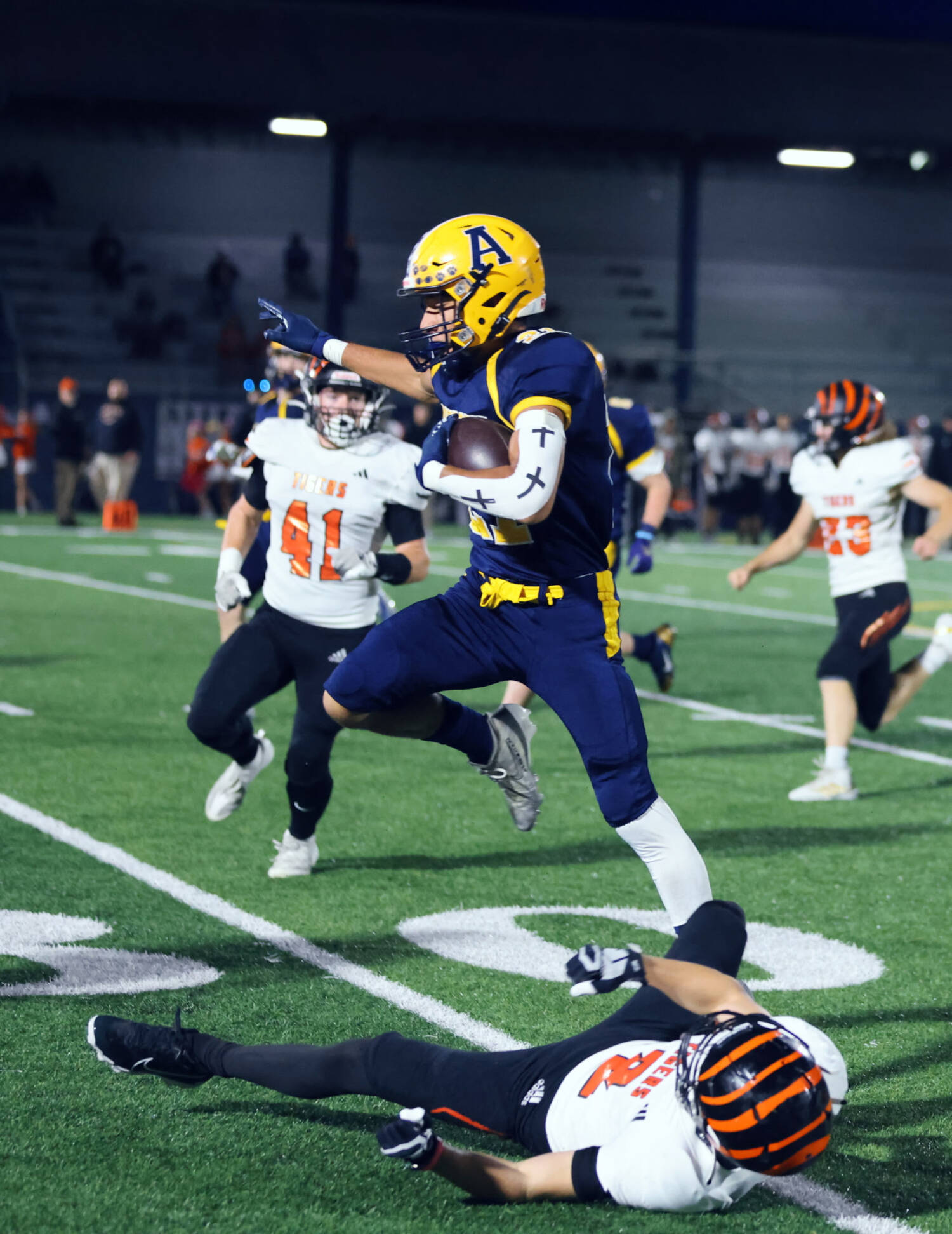 ERICA MCCRORY / MCCRORY PHOTOGRAPHY 
Aberdeen receiver Cordell Roberts hurdles a Centralia defender during a 50-20 win on Friday at Stewart Field in Aberdeen.