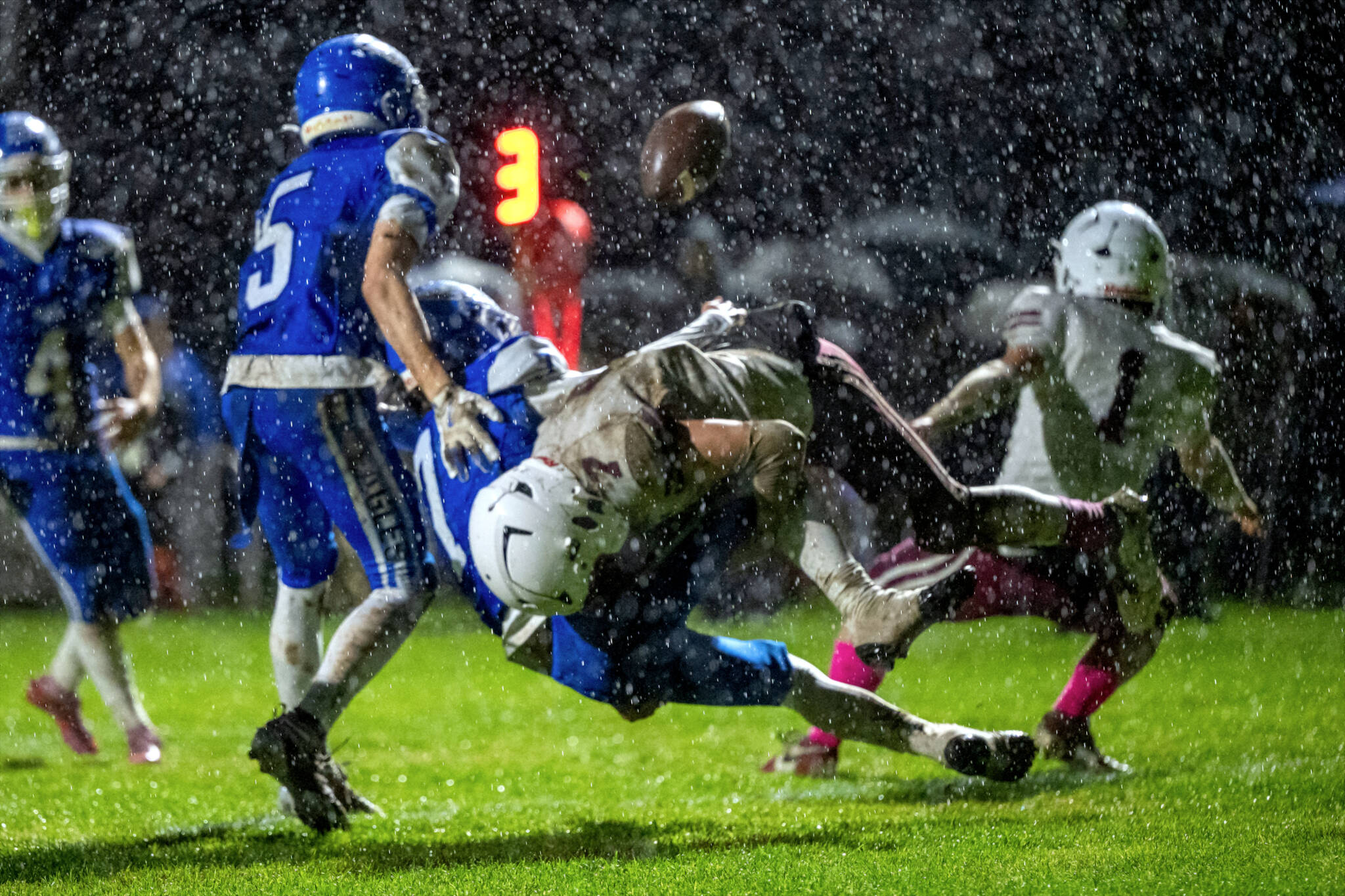 PHOTO BY FOREST WORGUM Hoquiam’s Tristan Turpin (middle) dislodges the ball from Elma’s Jaxon Brookins during the Eagles’ 13-9 win on Friday at Davis Field in Elma.