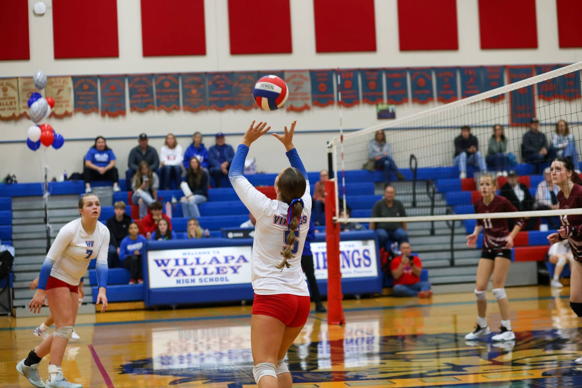 PHOTO BY LARRY BALE Willapa Valley setter Lauren Matlock (middle) sets to teammate Tylar Keeton (left) during a 3-1 victory over Ocosta on Monday at Willapa Valley High School.
