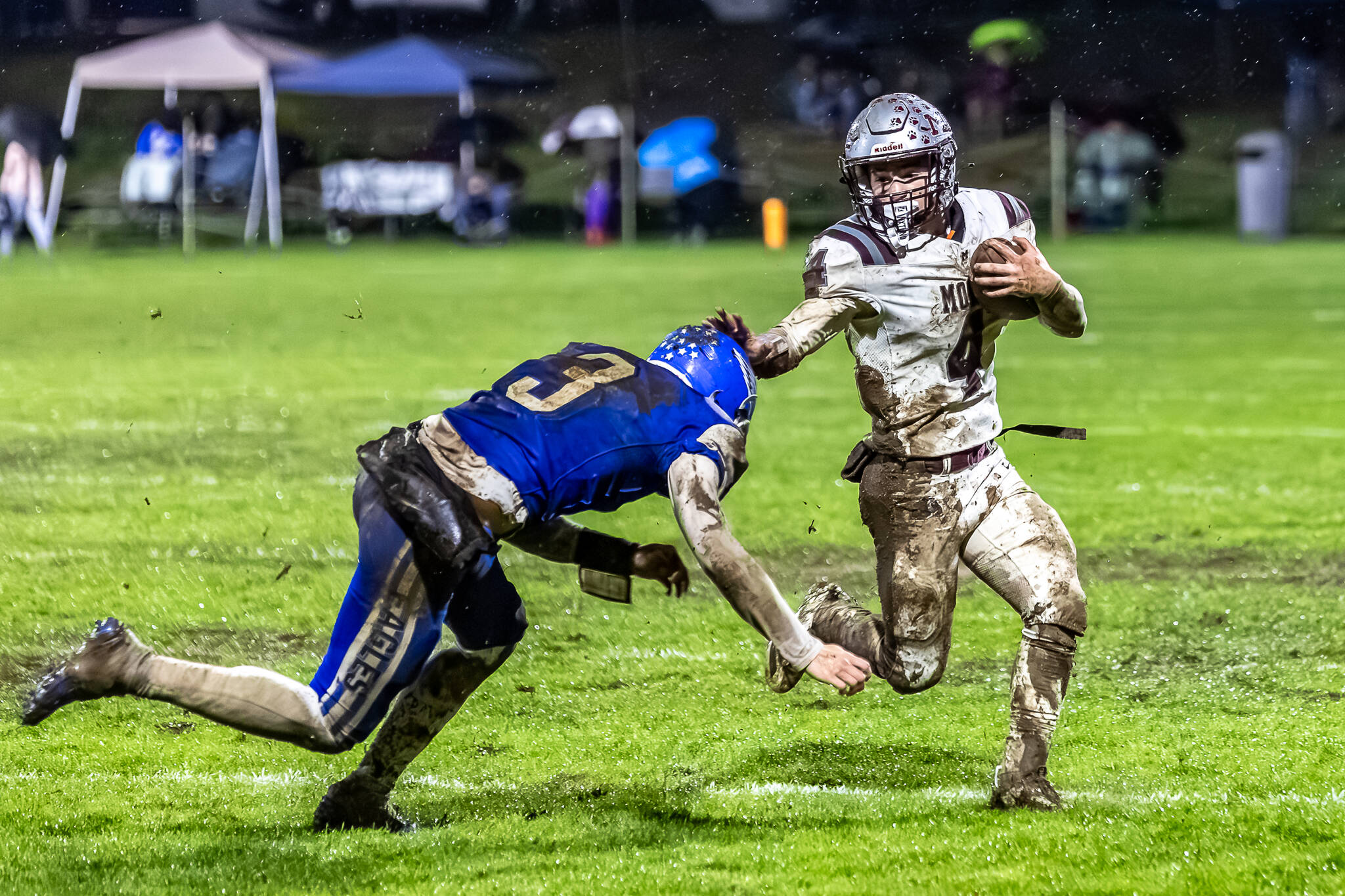 PHOTO BY MIKE ROBERTS Montesano running back Zach Timmons attempts to elude the tackle of Elma safety Isaac McGaffey during the Bulldogs’ 42-6 victory on Friday at Davis Field in Elma.