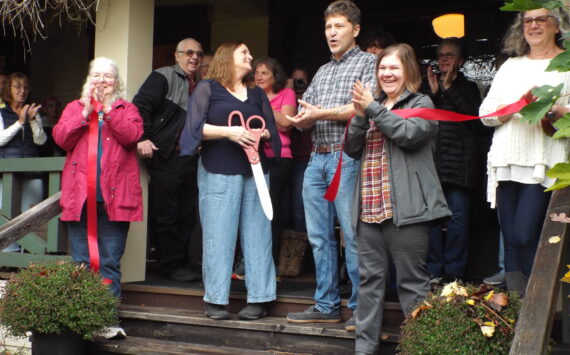 Andrea Watts / The Daily World 
Before Lorena Maurer did the honors of cutting the ribbon, Matthew Maurer addressed the attendees. “We’d like to say thank you to the community because we have heard nothing but signs of statements of relief and appreciation that we came in and took it up in the spirit of Penny and Everett to keep the restoration going. And we would also like to thank everybody that has helped out. Our friends and family, everybody that showed up today. Thank you so much for being here.”
