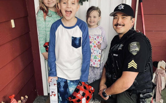 The Daily World file photo
Sgt. Stephen Heller helps distribute toys during last year’s Grays Harbor County Sheriff’s Department Holiday Toy Drive.
Sgt. Stephen Heller helps distribute toys during last year’s Grays Harbor County Sheriff’s Department Holiday Toy Drive. (The Daily World file photo)