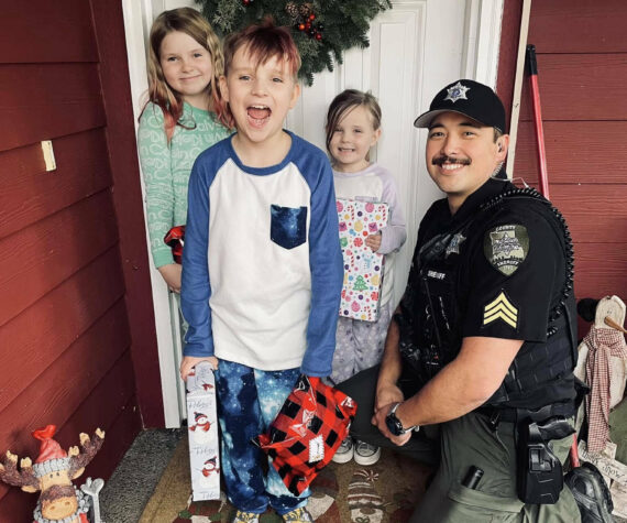 The Daily World file photo
Sgt. Stephen Heller helps distribute toys during last year’s Grays Harbor County Sheriff’s Department Holiday Toy Drive.
Sgt. Stephen Heller helps distribute toys during last year’s Grays Harbor County Sheriff’s Department Holiday Toy Drive. (The Daily World file photo)