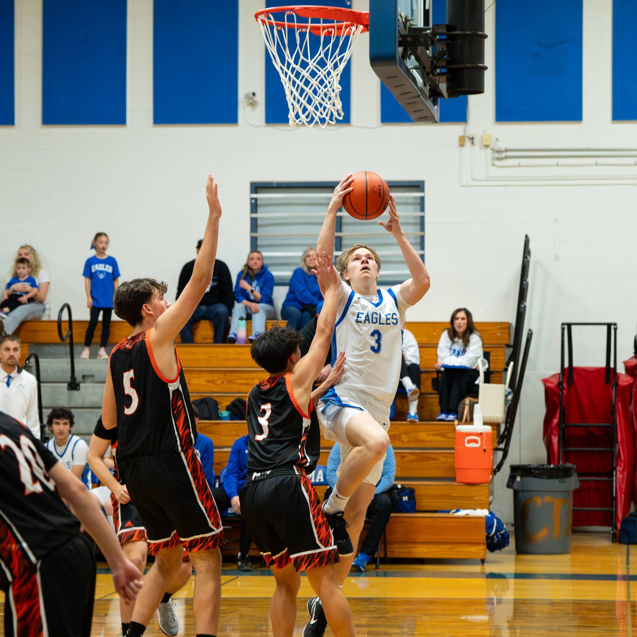 NICOLE SHANNON | MAIN FOCUS MEDIA Elma senior Isaac McGaffey (3) drives to the hoop to score two of his game-high 23 points during the a 66-56 win over Centralia on Tuesday at Elma High School.